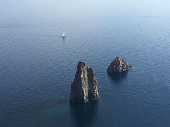 High angle view of rocks in sea