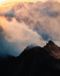 Low angle view of silhouette mountain against sky during sunset