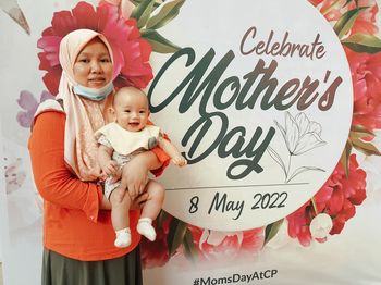 Portrait of cute girl with christmas tree