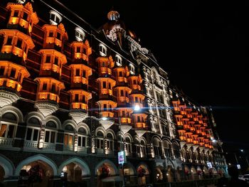 Low angle view of illuminated buildings at night