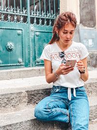 Young woman using mobile phone