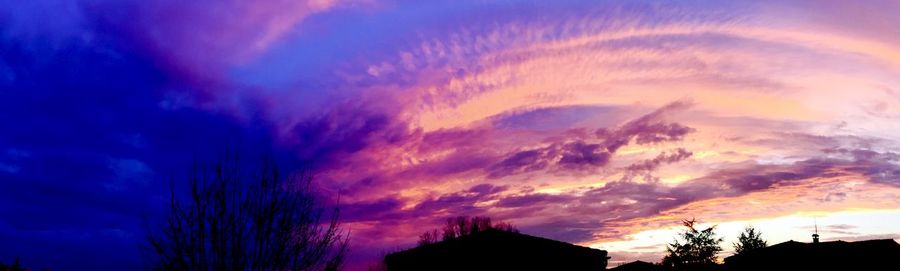 Low angle view of dramatic sky at sunset