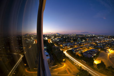 High angle view of illuminated buildings in city against sky