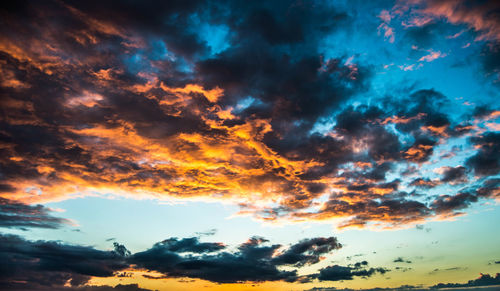 Low angle view of dramatic sky during sunset