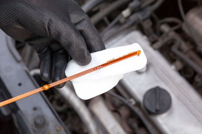 Cropped image of mechanic repairing car