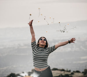 Full length of woman standing against the sky