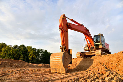 Excavator dig sand at the open-pit. heavy machinery working in the mining quarry. 