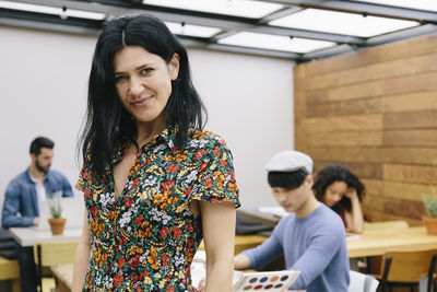 Portrait of young woman in office