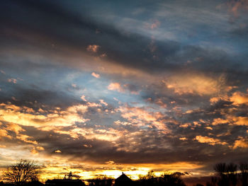 Low angle view of dramatic sky during sunset