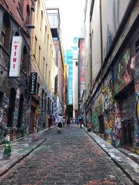 People walking on street in city