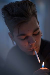 Close-up of man igniting cigarette