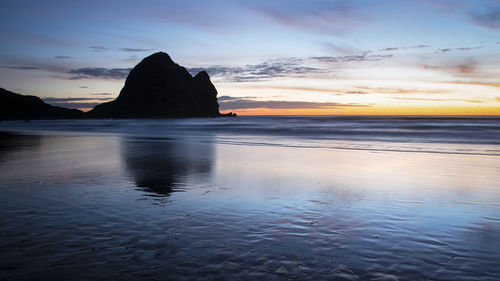 Scenic view of sea against sky during sunset