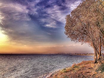 Scenic view of sea against cloudy sky