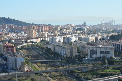 High angle view of buildings in city against clear sky