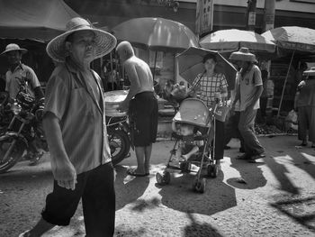 People walking on street in city