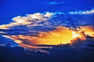 Scenic view of clouds in sky at sunset