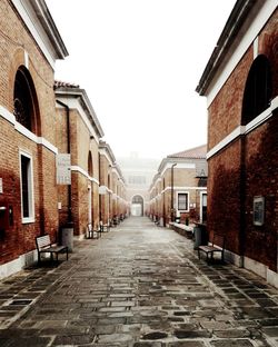 Narrow alley along buildings