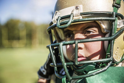 Close-up of american football player looking away