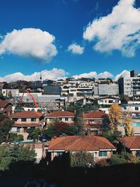 High angle view of townscape against blue sky