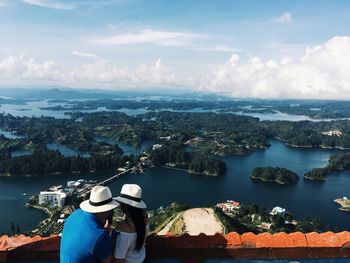 High angle view of woman by sea against sky