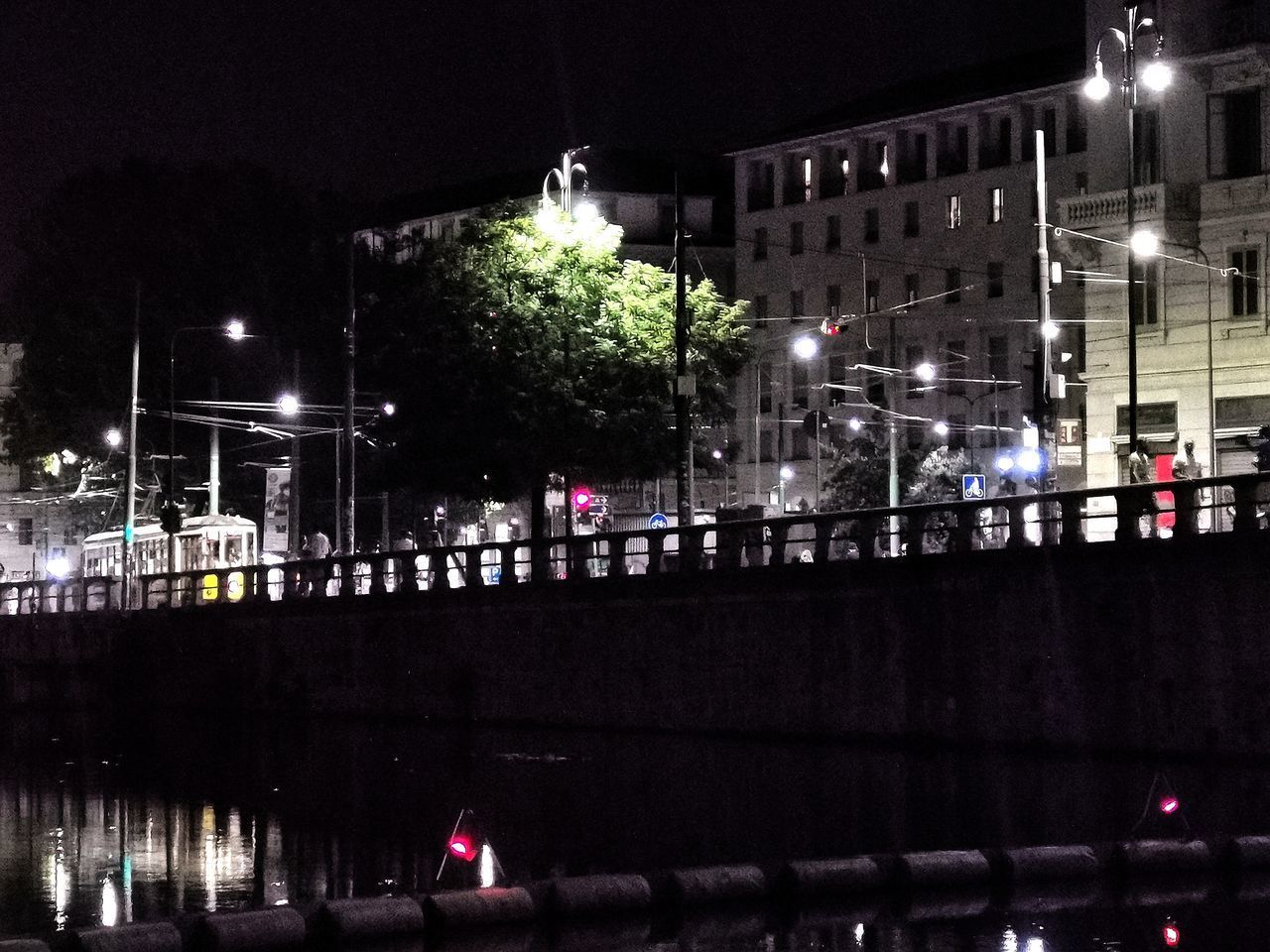 ILLUMINATED STREET LIGHTS AT NIGHT