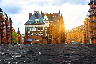 View of buildings against cloudy sky