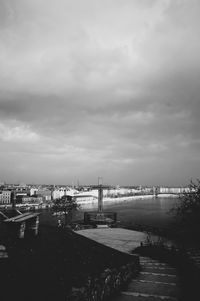 High angle view of river by buildings against sky