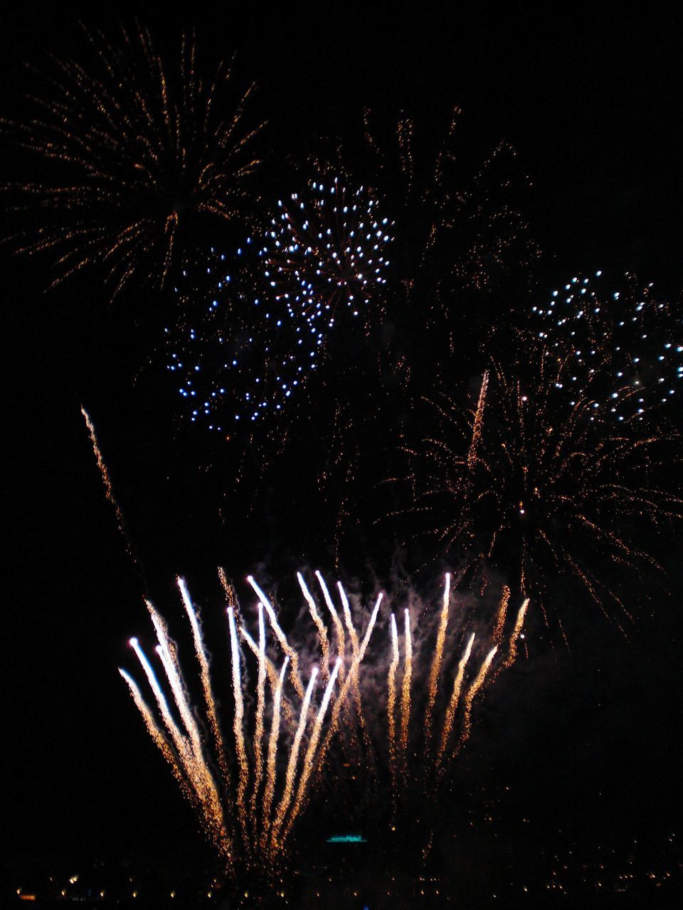 LOW ANGLE VIEW OF FIREWORK DISPLAY