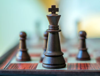 Chess pieces are standing on the board. black chess king. close-up.