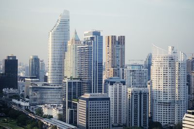 Modern buildings in city against sky