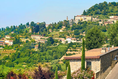 High angle view of townscape and trees against sky