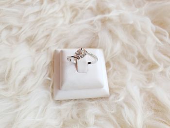 High angle view of wedding rings on white background