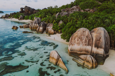 Rocks on shore by sea