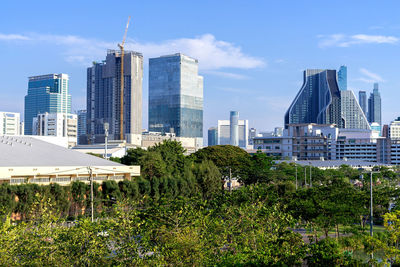 Modern buildings in city against sky