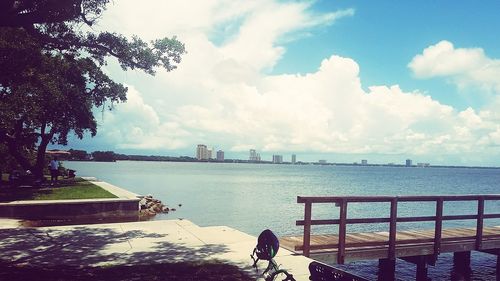 Scenic view of sea and city against sky