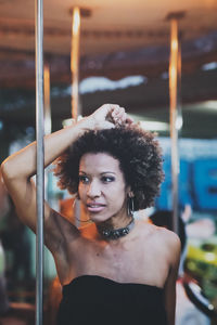 Portrait of woman standing outdoors