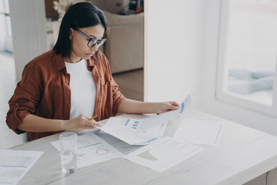 Side view of man working at office