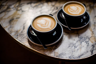 Coffee cups on table