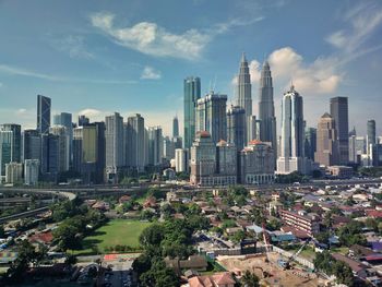 Modern buildings in city against sky