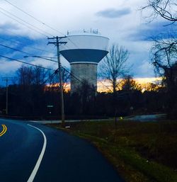 Empty road against cloudy sky