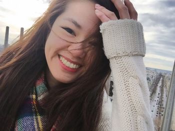 Portrait of smiling young woman outdoors