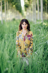 Portrait of smiling young woman on field