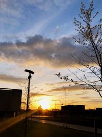 Street against sky during sunset