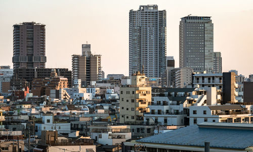 Buildings in city against sky