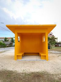 Yellow built structure against sky