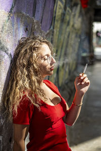 Young woman smoking cigarette