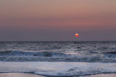 Scenic view of sea at sunset