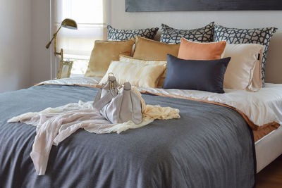 Clothes drying on bed at home