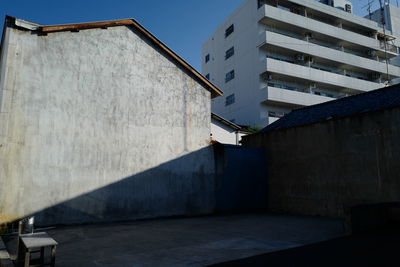 Buildings against sky on sunny day