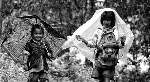 Children playing with umbrella